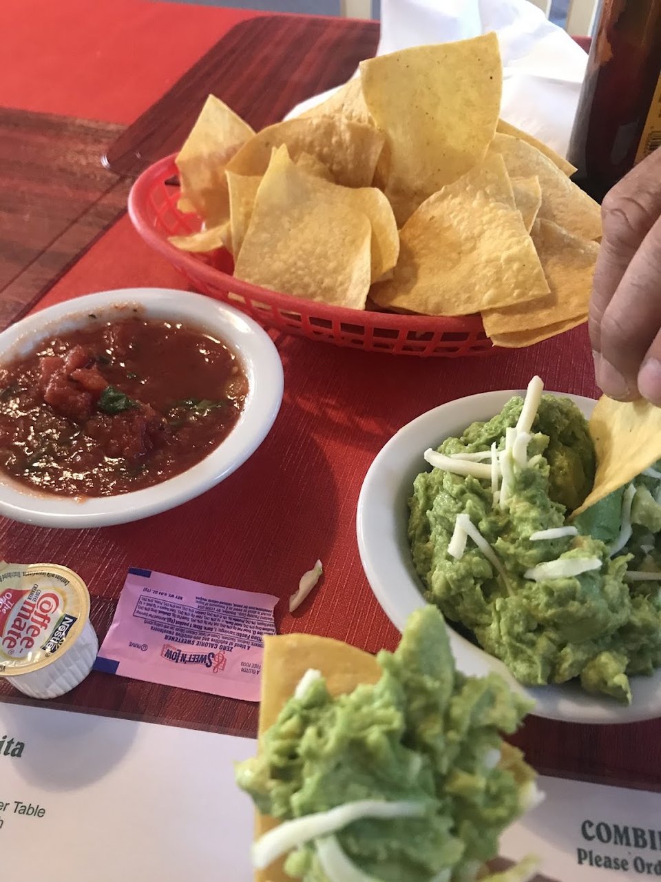 Menu board with tacos, burritos, and enchiladas.