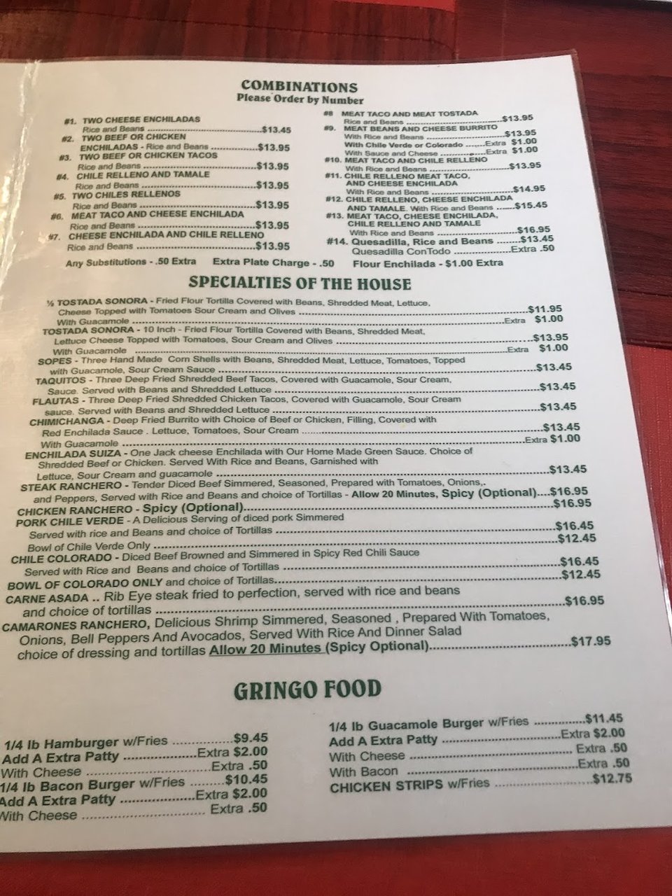 Menu board with tacos, burritos, and enchiladas.